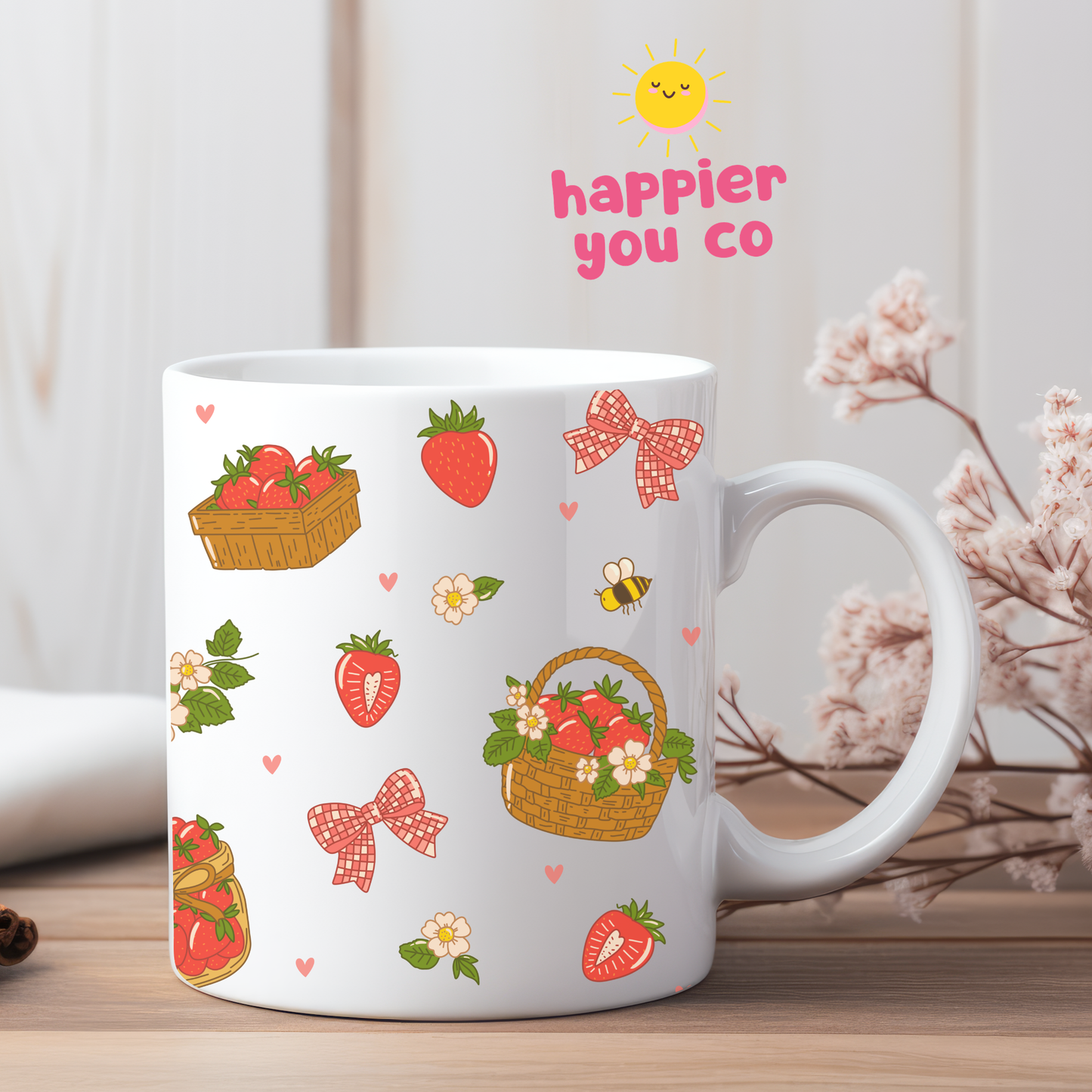 White mug with strawberry and basket design on a wooden surface with decorative elements.