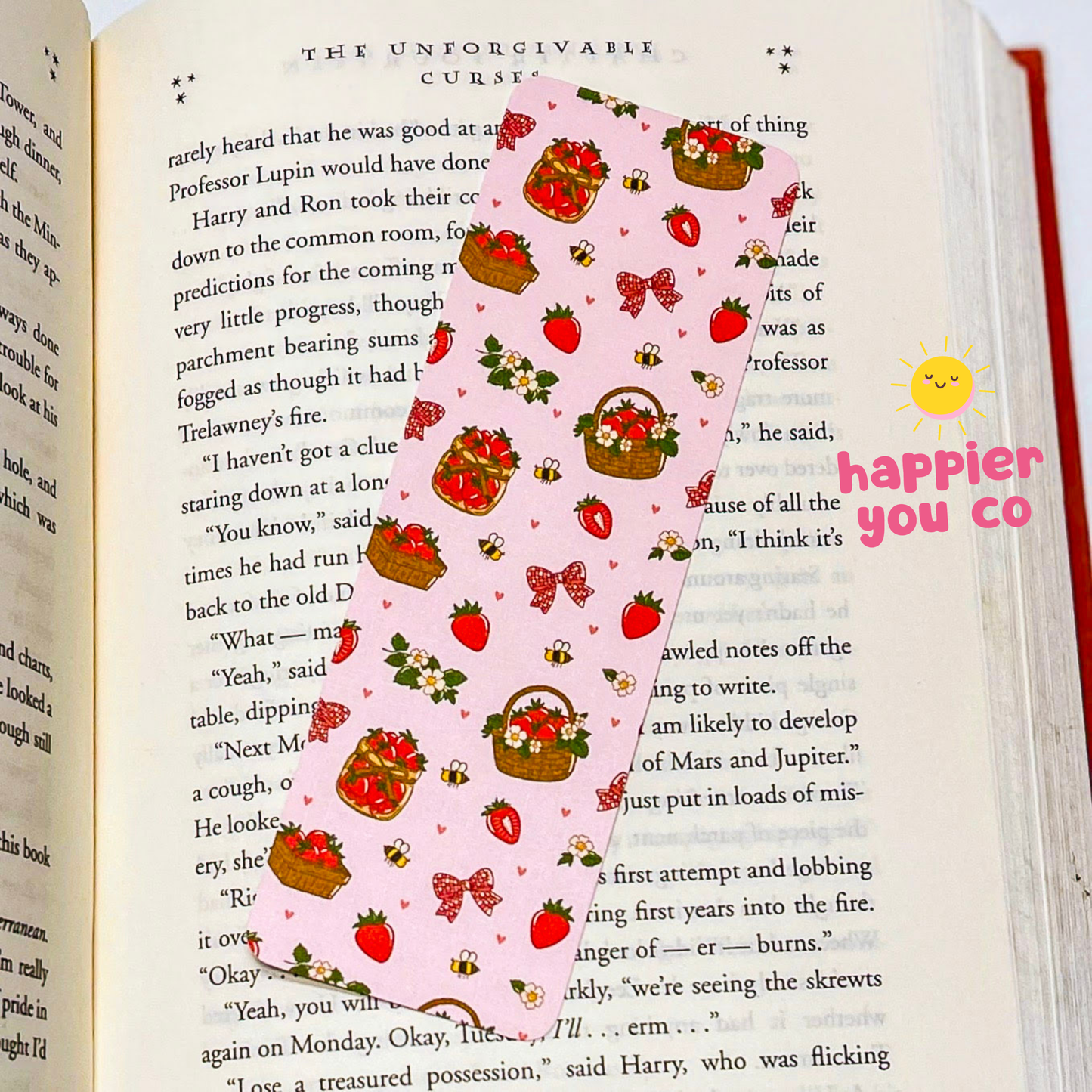 Pink decorative paper with strawberry pattern on an open book