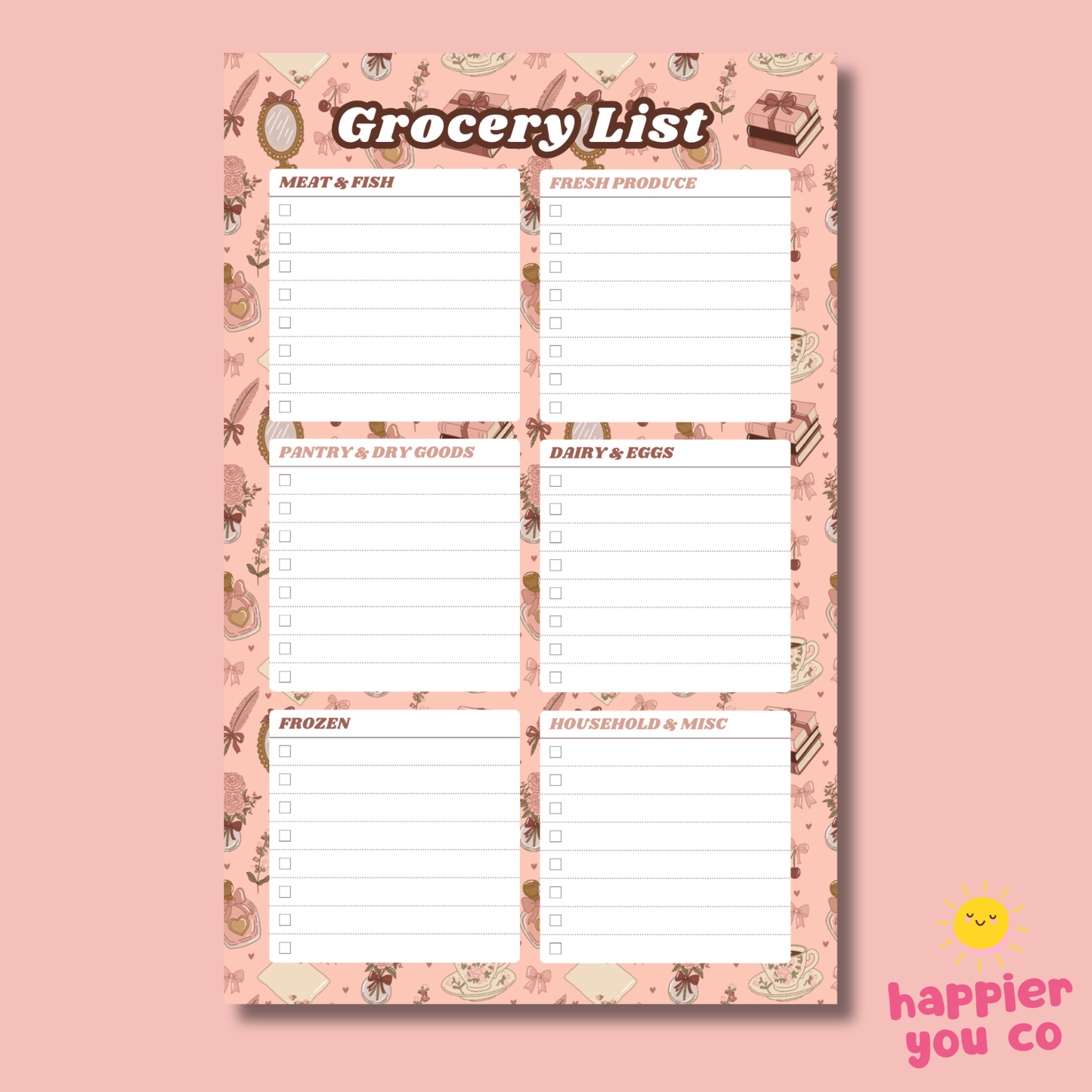 Grocery list notepad with a pink border on a pink background, featuring the brand 'happier you co'.