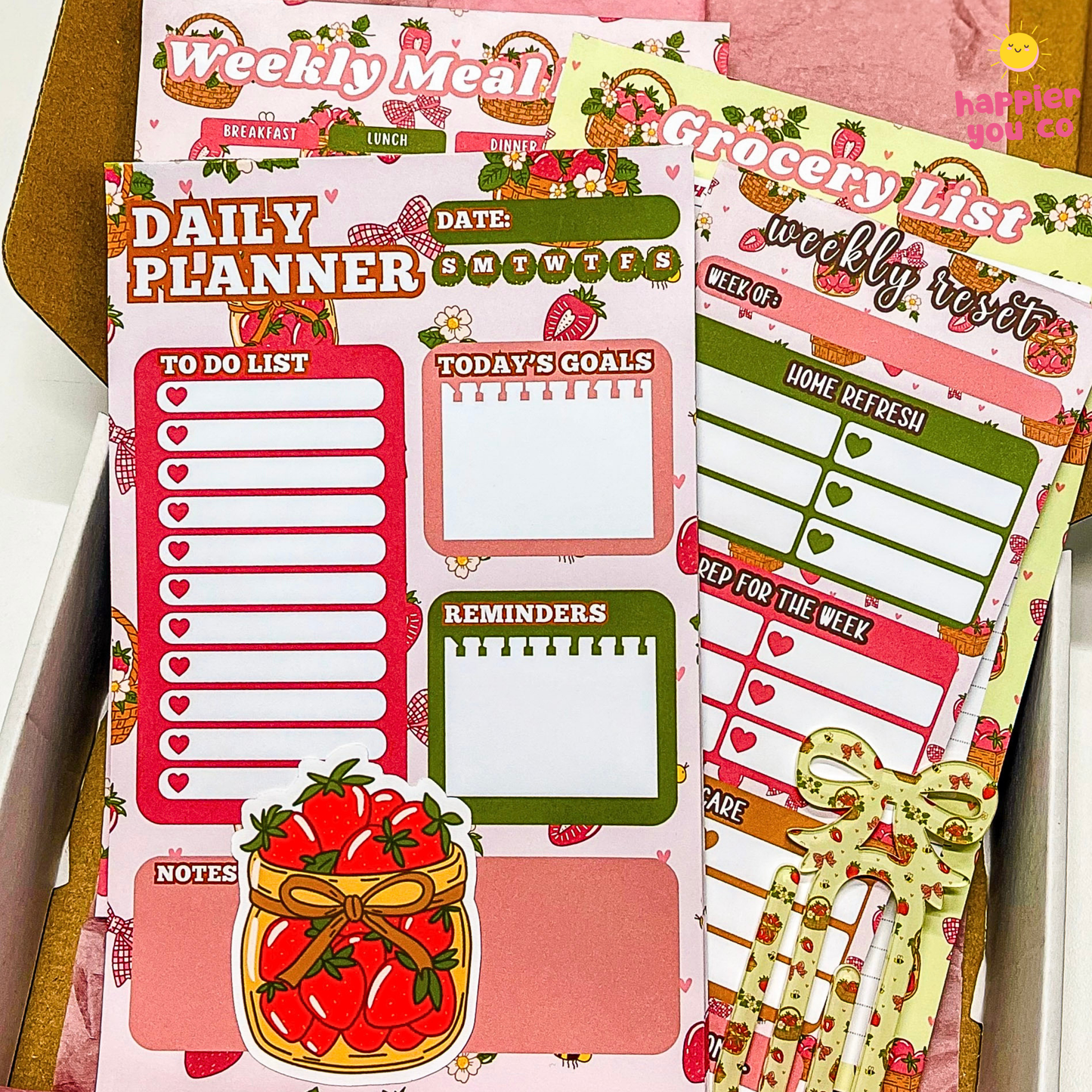 Set of daily planner and grocery list sheets with strawberry-themed design.