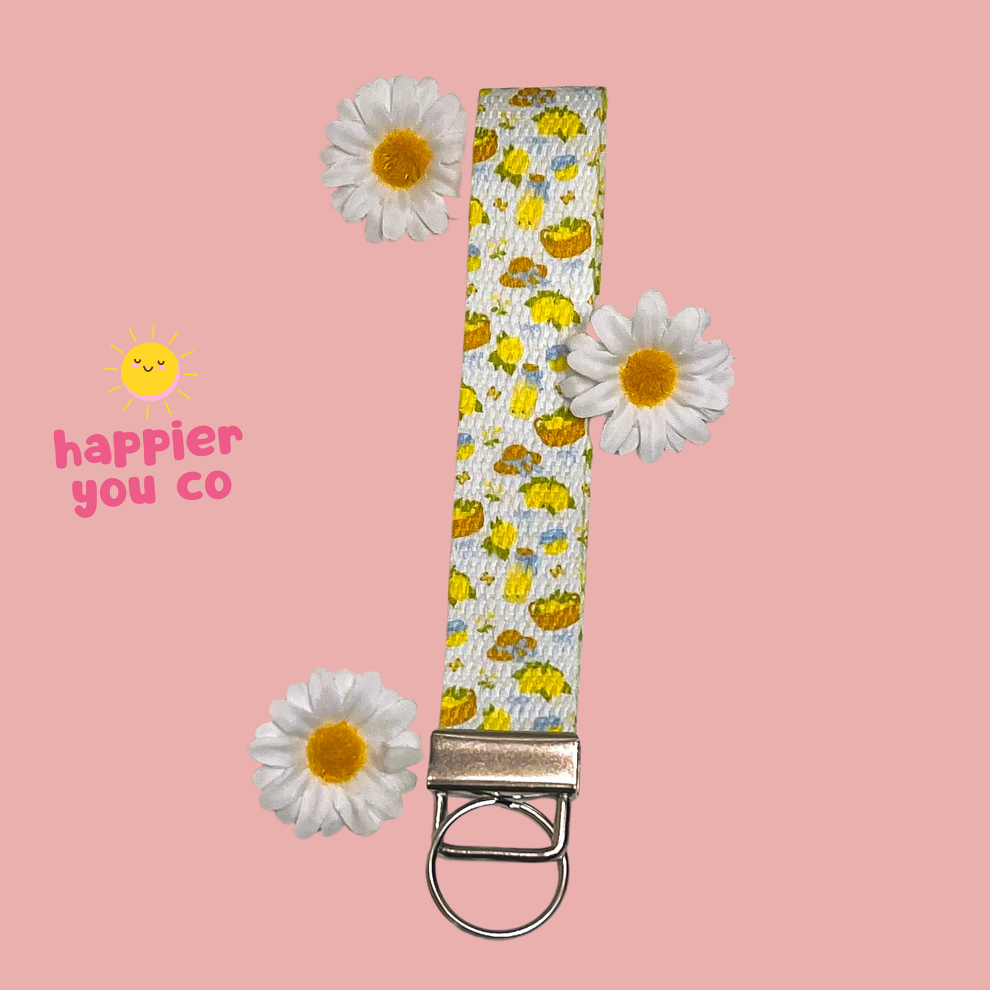 Wristlet keychain with a lemon and daisy pattern
