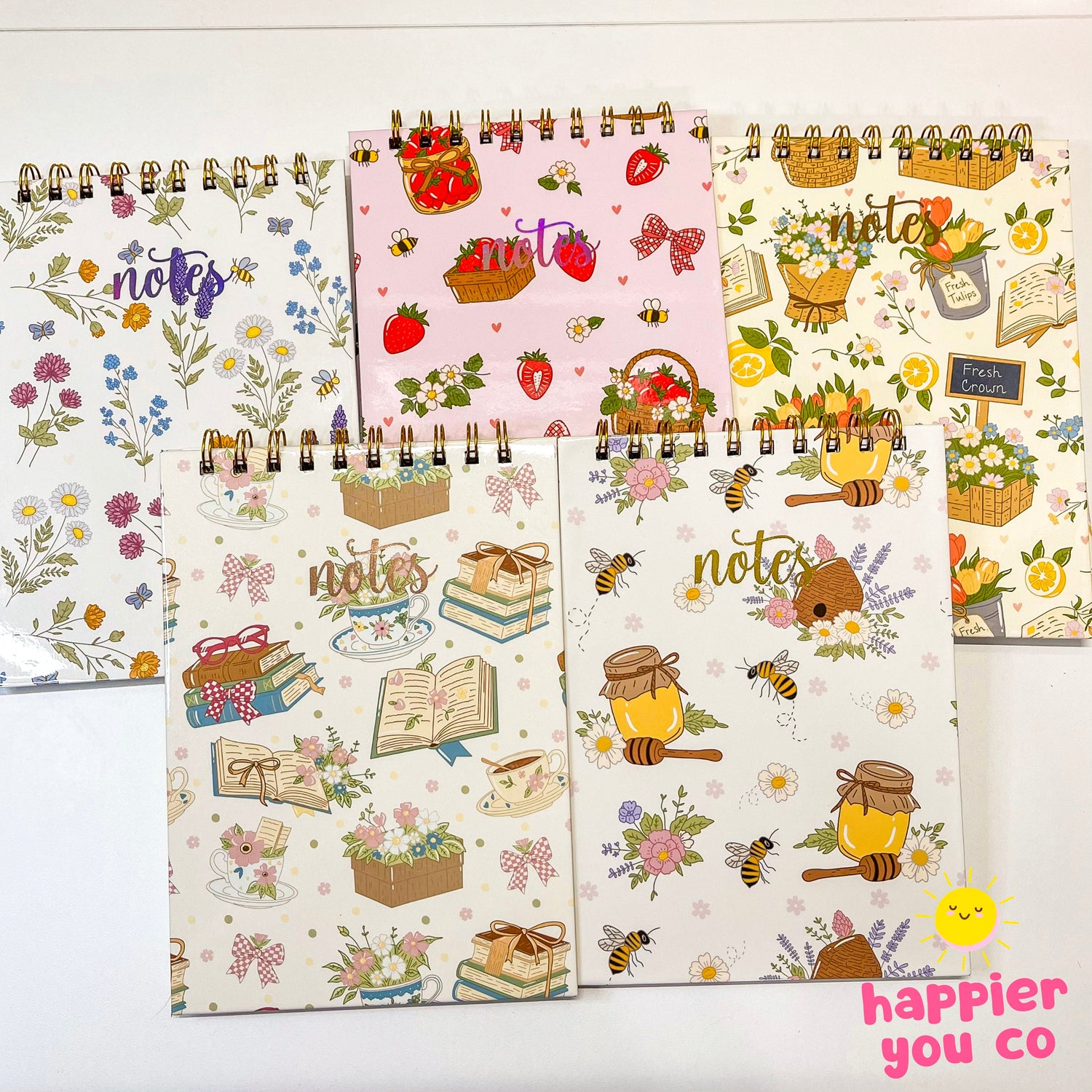 A variety of A5 sized notebooks with different colorful designs