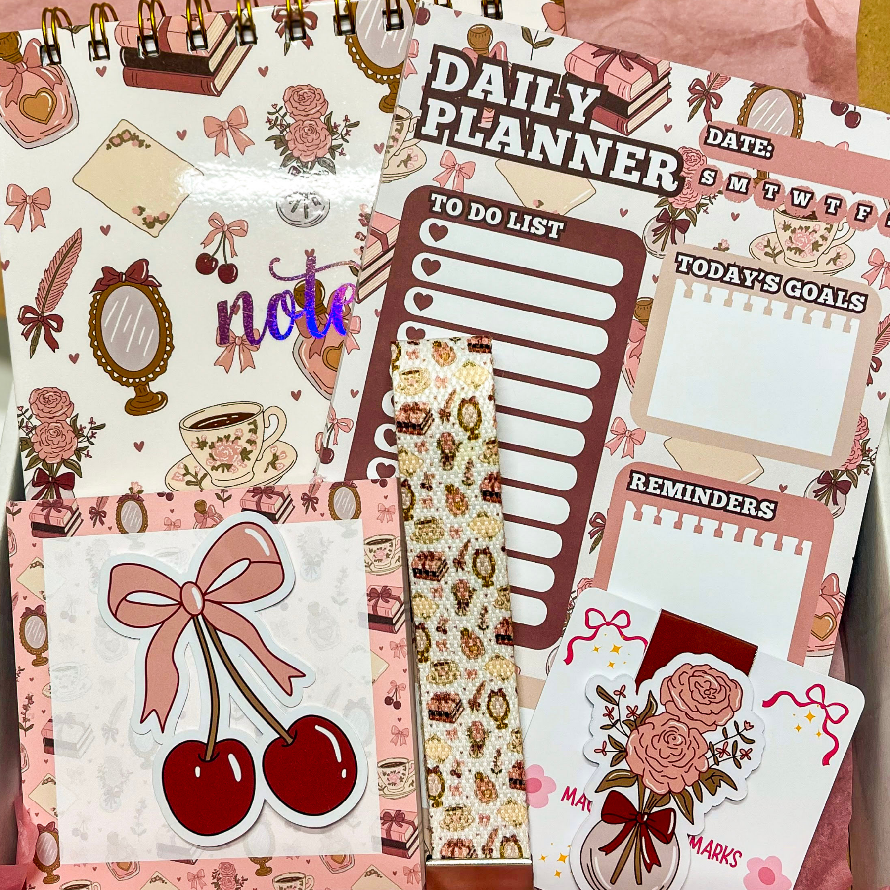 Collection of decorative planner stickers with various designs on a pink background.