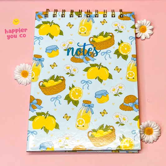Notebook with lemon and jar pattern on a pink background