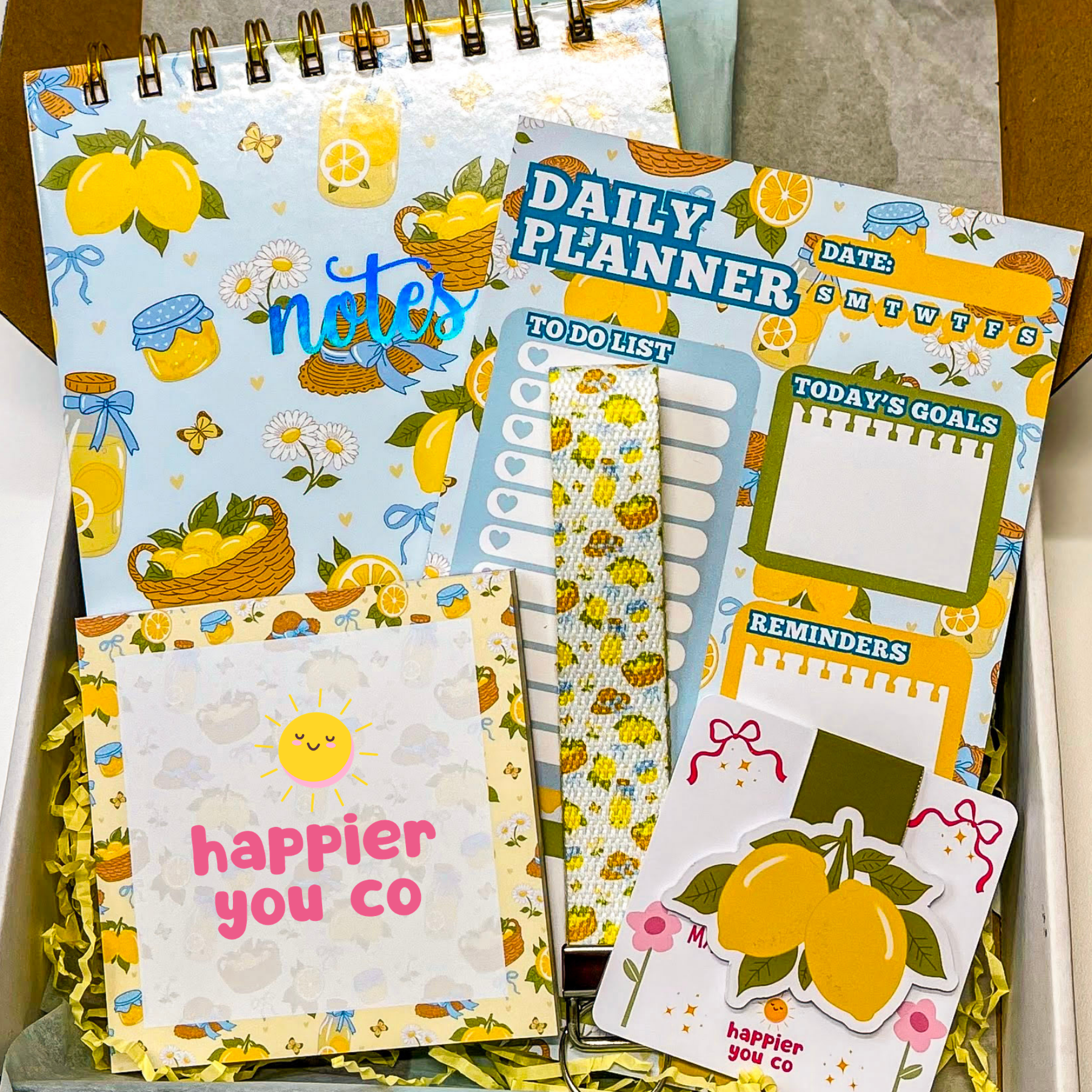 Set of colorful planners and notes with lemon-themed design