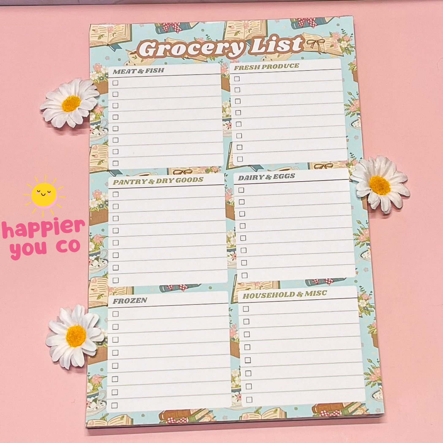 Grocery list notepad with floral design on a pink background