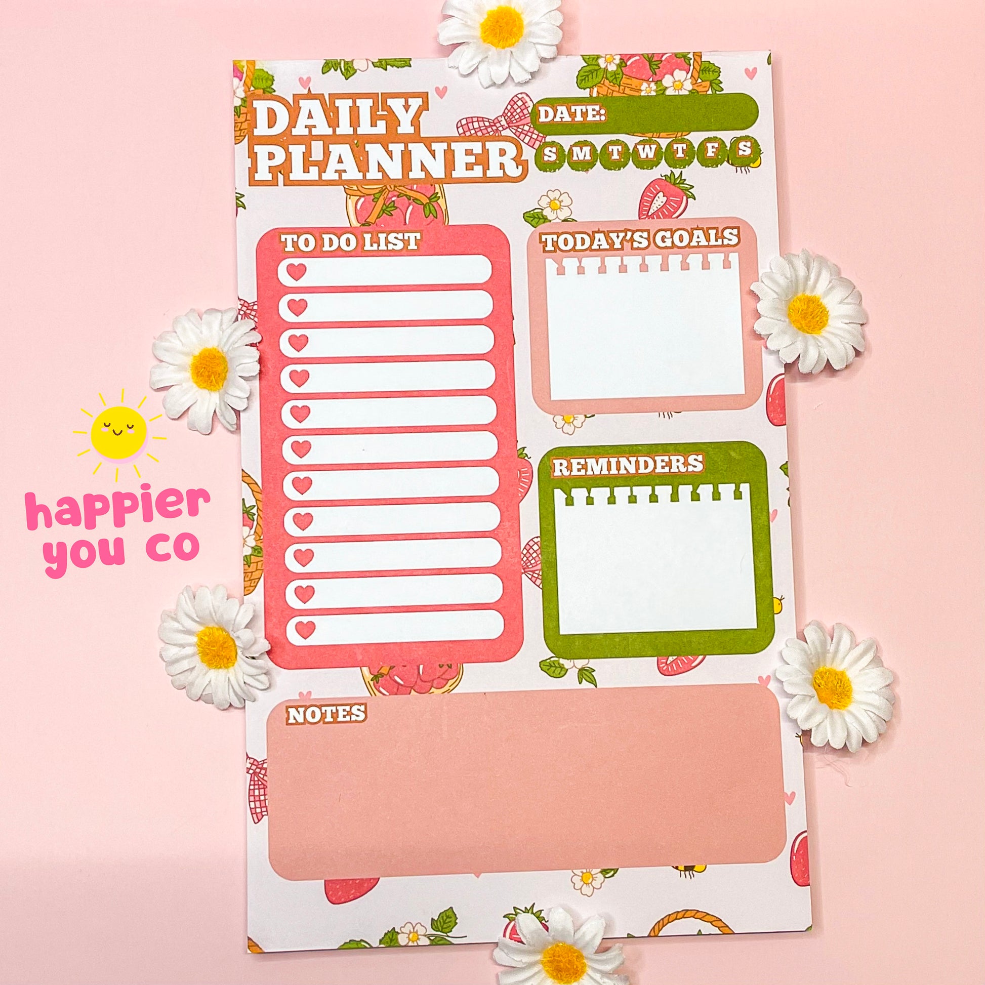Daily planner with various sections on a pink background with daisies