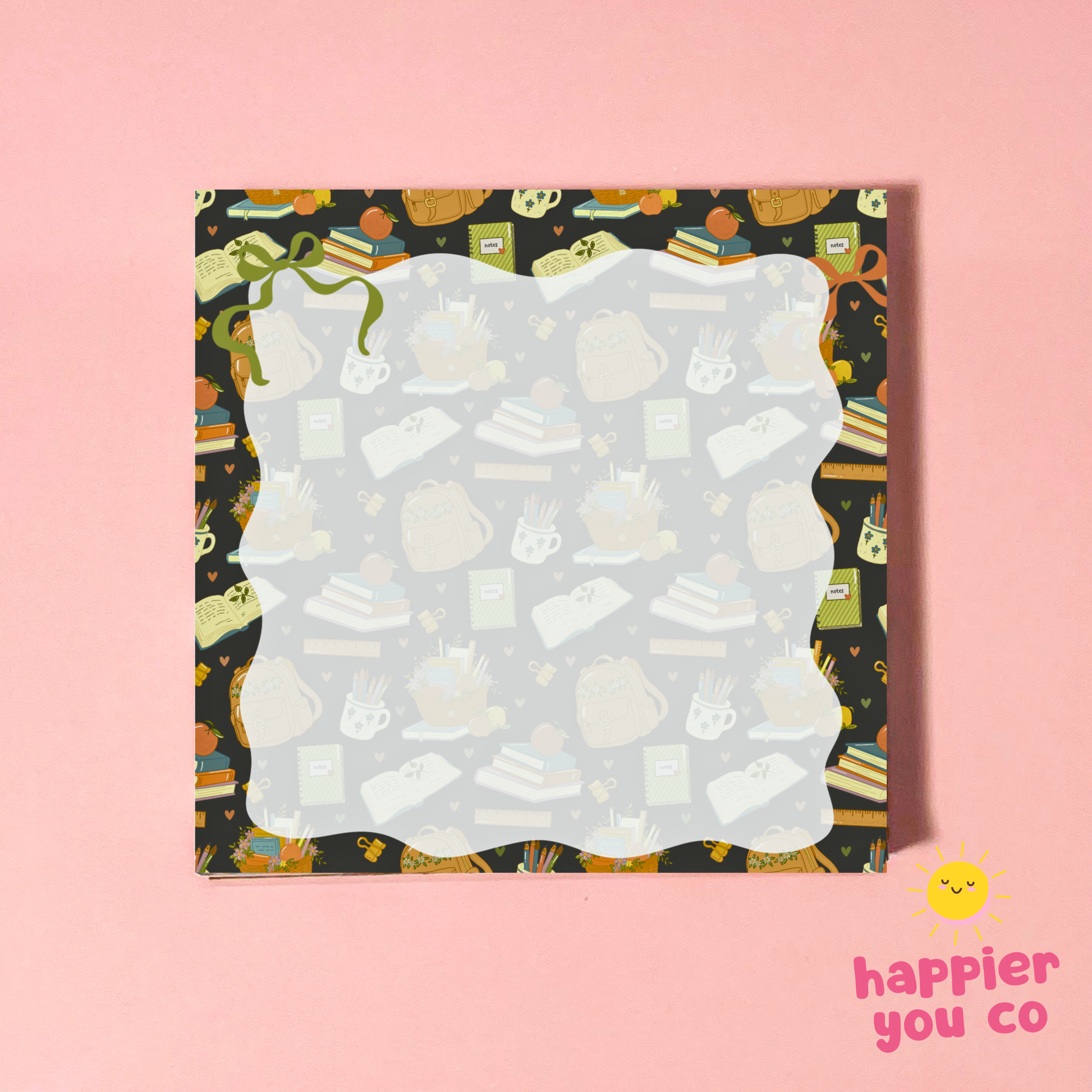 A square notepad with a wavy white center and a dark patterned border featuring school and study-themed illustrations, displayed on a solid pink background with a 'happier you co' logo in the bottom right corner.