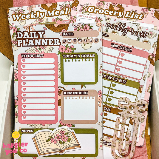 Planner stickers with daily planner, grocery list, and to-do list on a wooden surface.