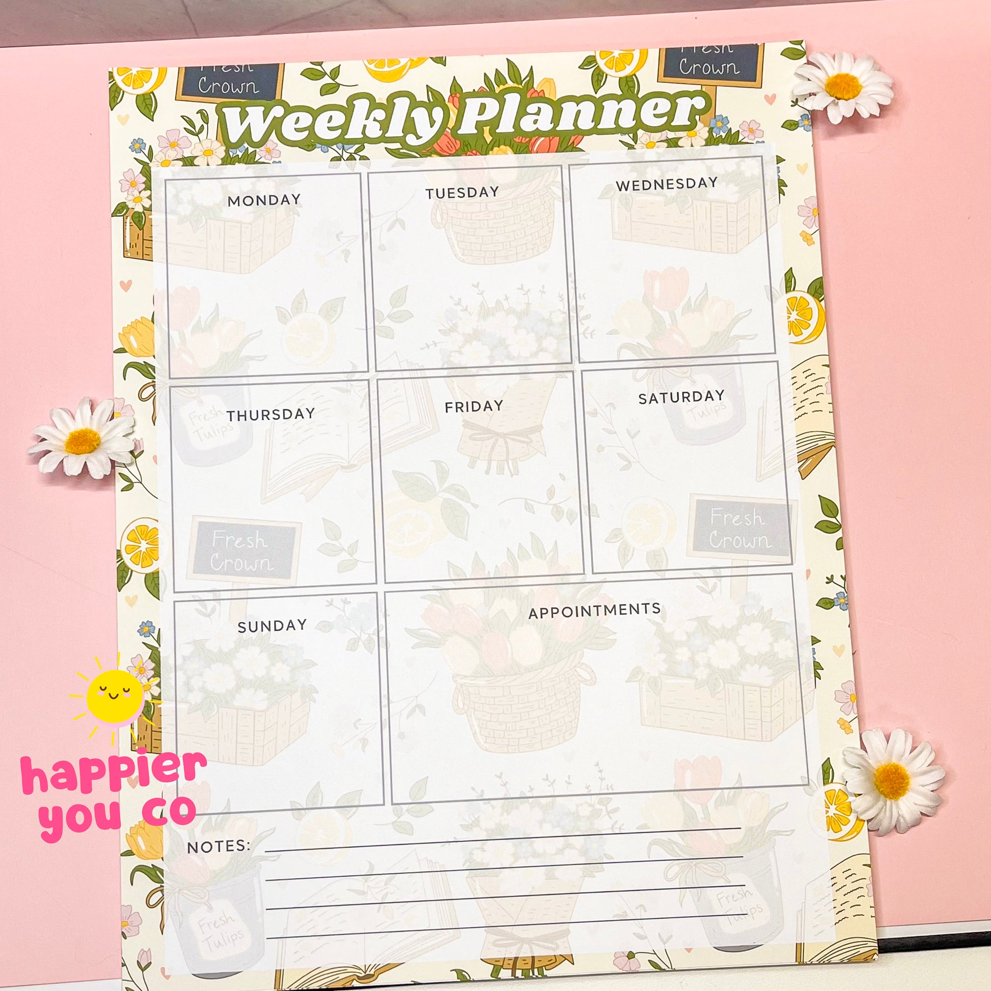 Weekly planner sheet with floral border on a pink background