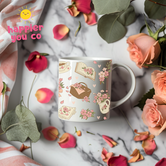 Mug with floral design on a marble surface with flowers and leaves
