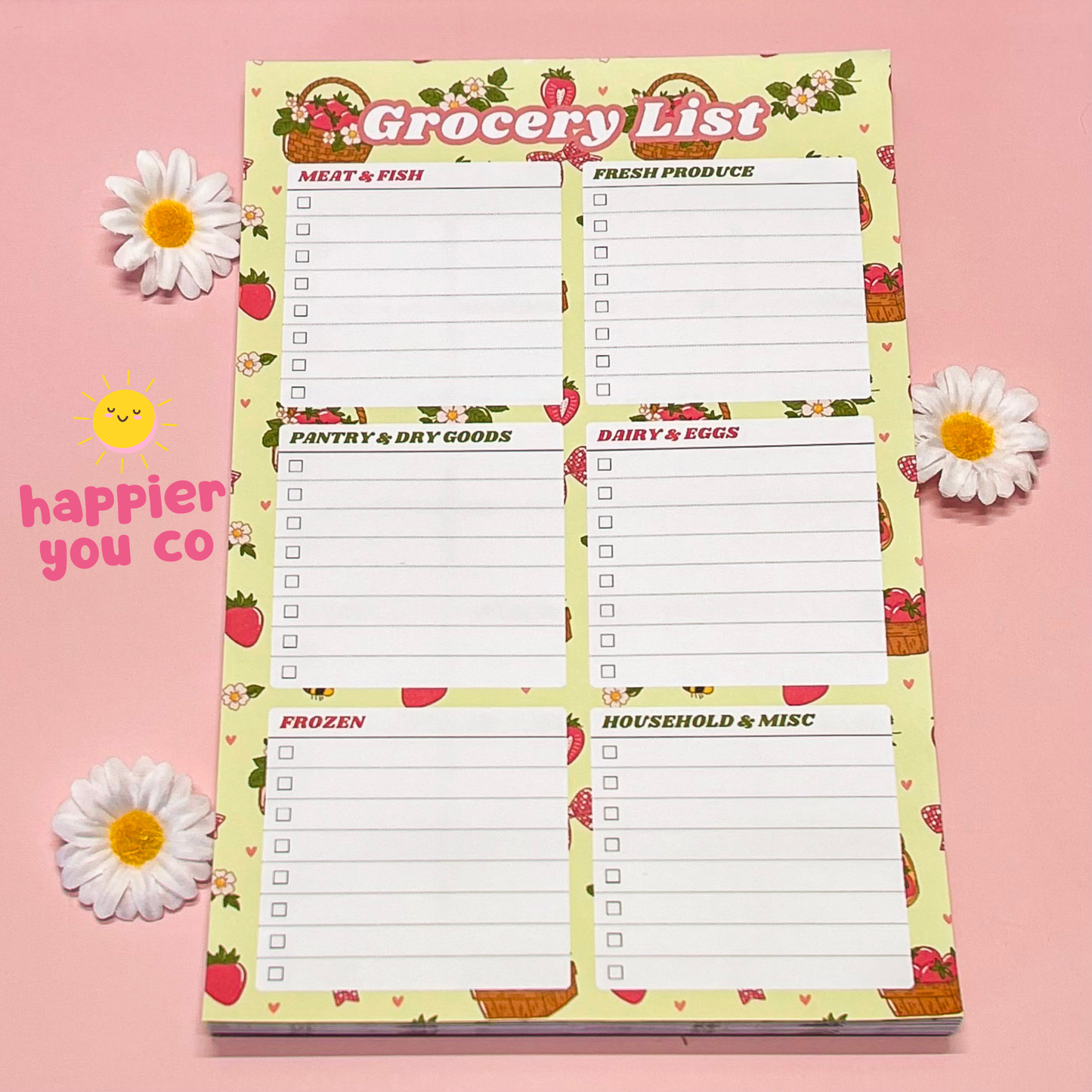 Grocery list notepad with floral design on a pink background
