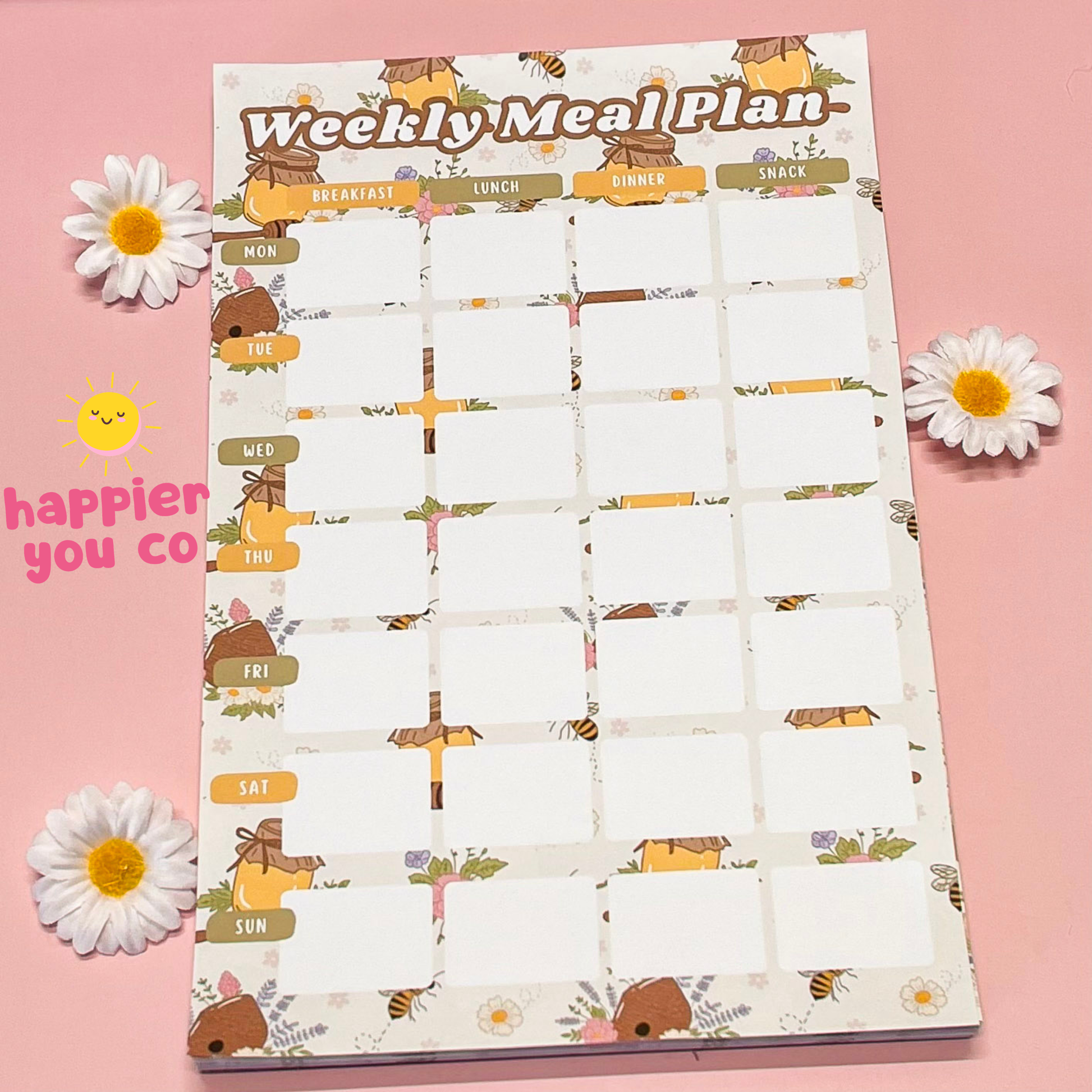 Weekly meal plan chart with cartoon animals on a pink background