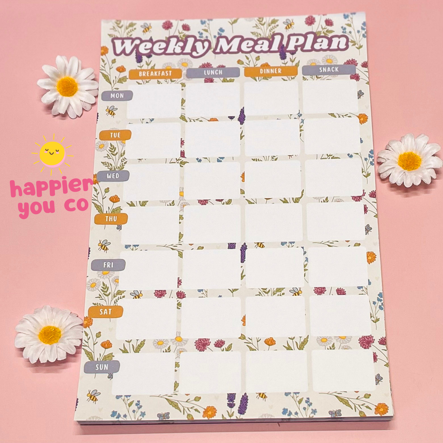 Weekly meal plan chart with floral design on a pink background